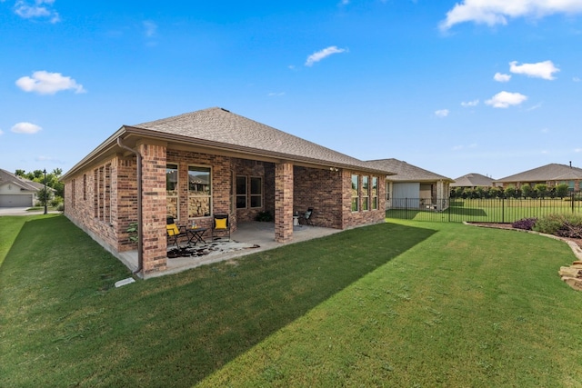 back of property featuring a yard and a patio