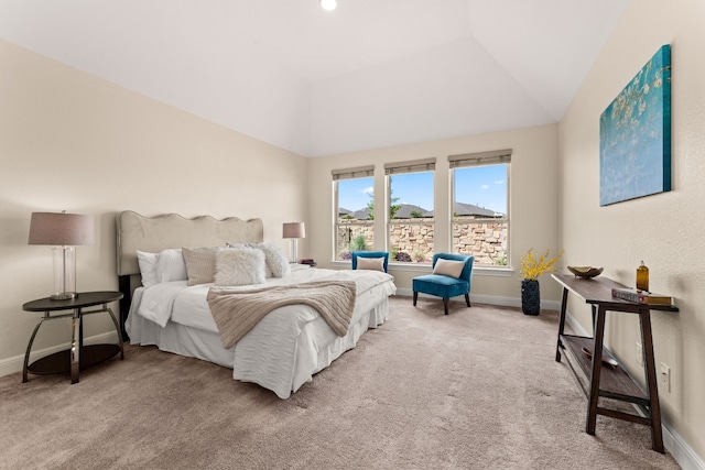 carpeted bedroom with vaulted ceiling