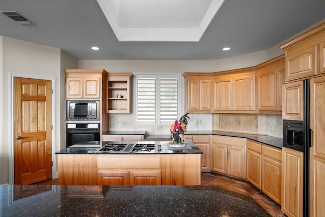 kitchen featuring built in appliances, a center island, light brown cabinetry, and tasteful backsplash