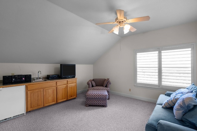 sitting room with light carpet, ceiling fan, lofted ceiling, and sink