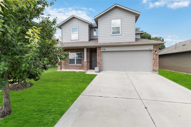 view of front of home featuring a garage and a front lawn