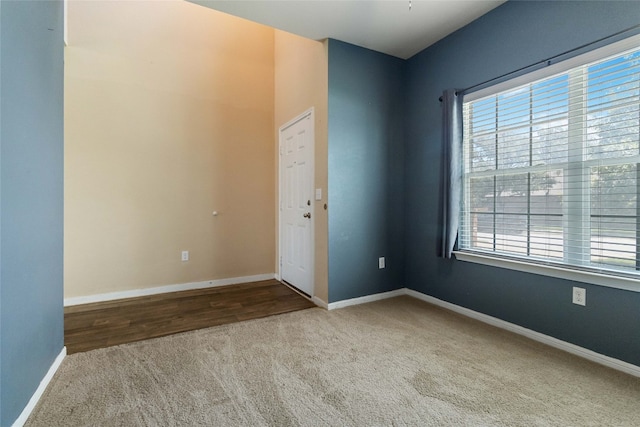 carpeted empty room featuring a healthy amount of sunlight