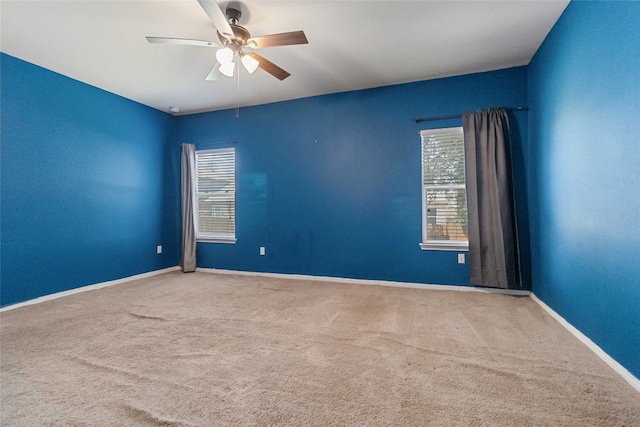 carpeted empty room with ceiling fan