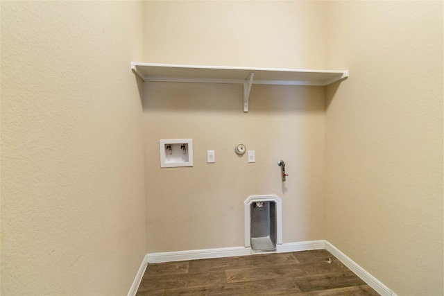 laundry area featuring gas dryer hookup, hardwood / wood-style flooring, and washer hookup