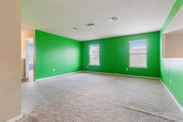 empty room featuring carpet flooring