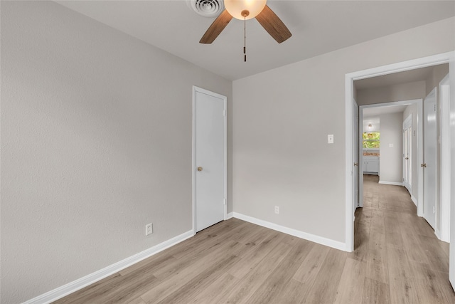 unfurnished room featuring ceiling fan and light hardwood / wood-style floors