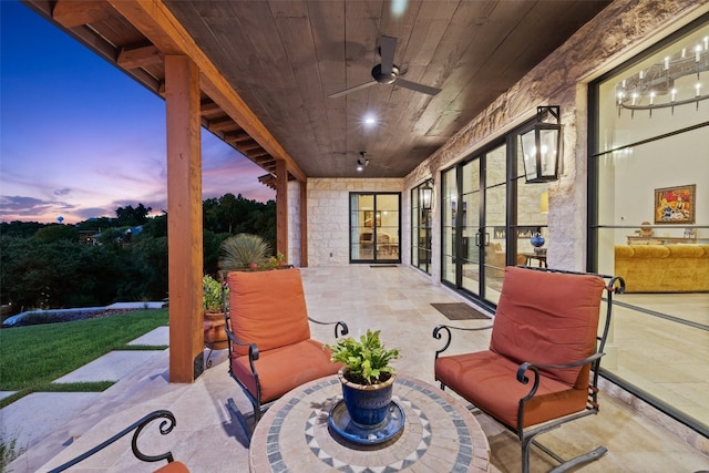 patio terrace at dusk with ceiling fan