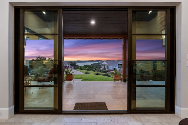 doorway featuring light tile patterned floors