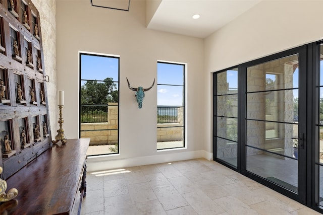 doorway with light tile patterned flooring