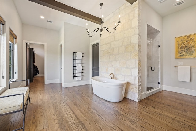 bathroom featuring beamed ceiling, a notable chandelier, plus walk in shower, and hardwood / wood-style floors