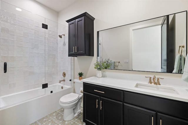 full bathroom featuring tile patterned floors, vanity, bath / shower combo with glass door, and toilet