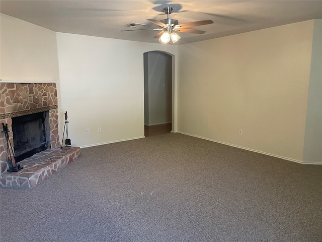 unfurnished living room with ceiling fan and carpet flooring