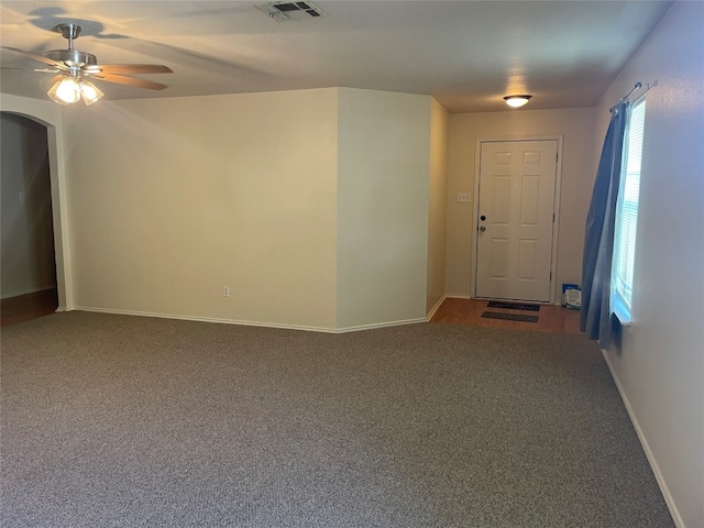 interior space featuring carpet and ceiling fan