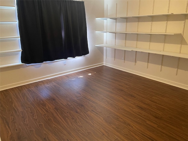 spare room with dark hardwood / wood-style floors