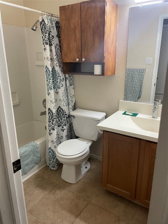 full bathroom with tile patterned floors, toilet, shower / bathtub combination with curtain, and vanity