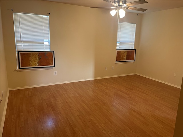 unfurnished room featuring ceiling fan and hardwood / wood-style flooring