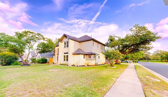 view of home's exterior featuring a yard