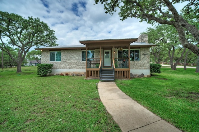 view of front facade with a porch and a front lawn