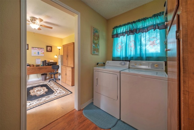 laundry room with separate washer and dryer, a textured ceiling, ceiling fan, and light hardwood / wood-style floors