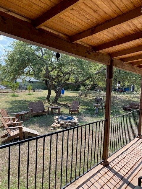 wooden deck featuring a fire pit