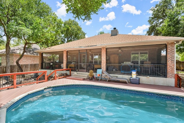 view of swimming pool with a wooden deck