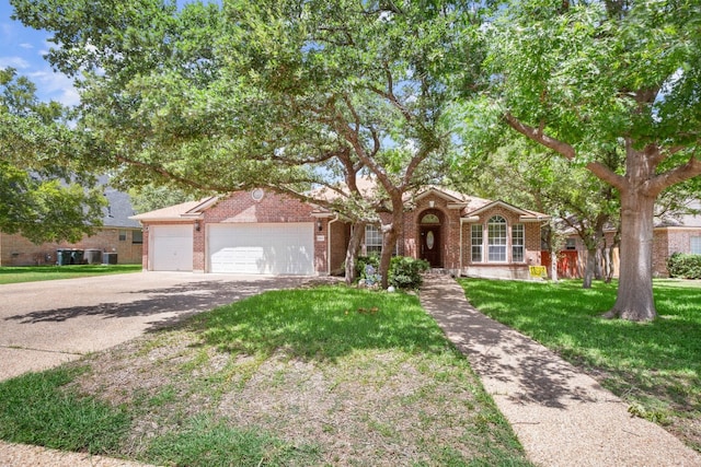 single story home featuring a front yard and a garage