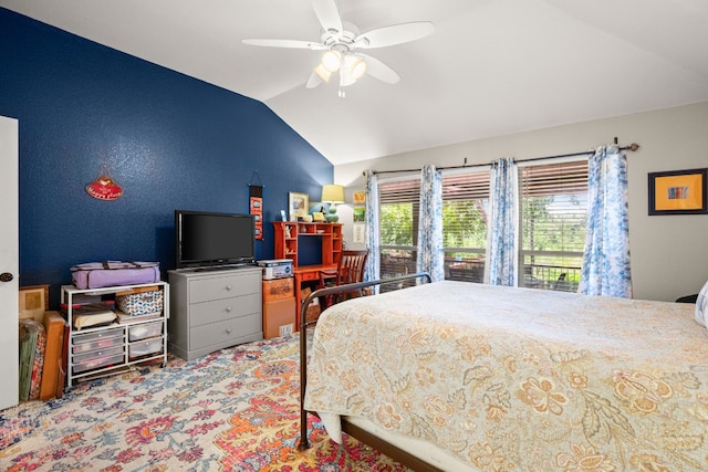 carpeted bedroom featuring vaulted ceiling and ceiling fan