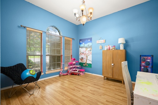 office featuring light hardwood / wood-style flooring and a chandelier