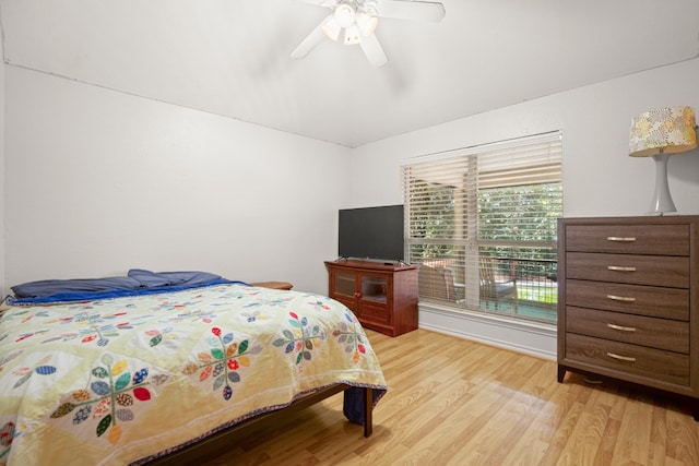 bedroom with ceiling fan and light hardwood / wood-style floors