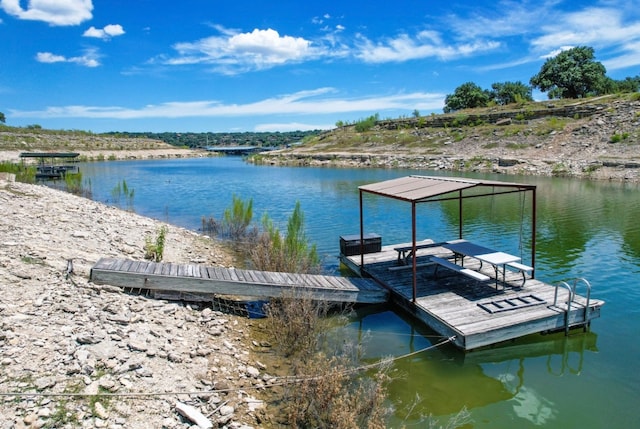 view of dock with a water view