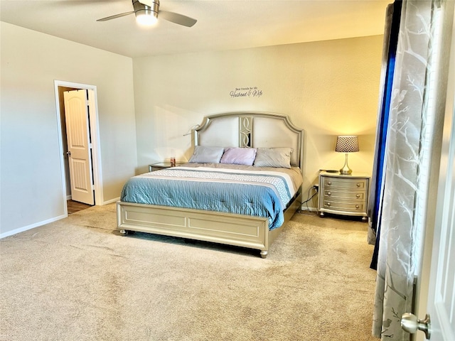 bedroom with ceiling fan and light carpet