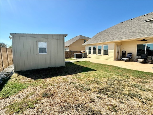 view of yard with cooling unit and a patio