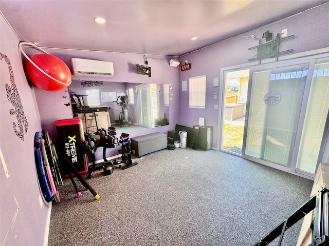 workout room featuring a wall mounted air conditioner