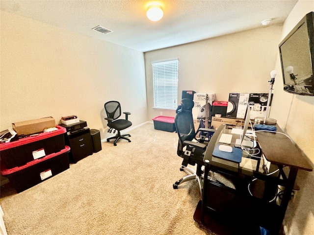 office with carpet flooring and a textured ceiling