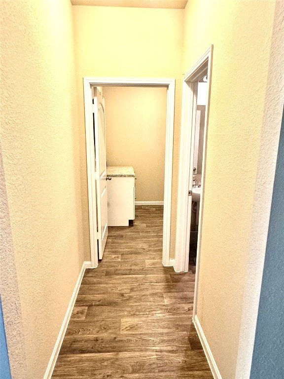 hallway featuring hardwood / wood-style flooring