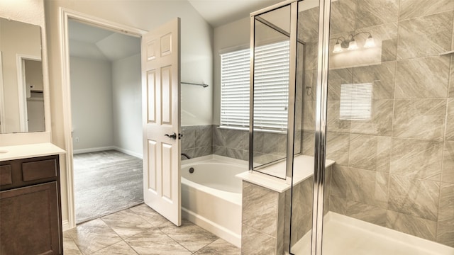 bathroom featuring vanity and separate shower and tub