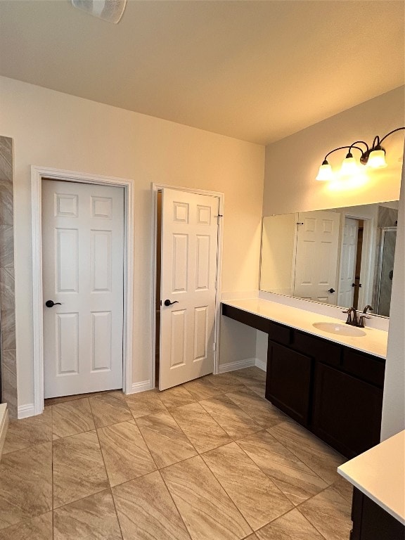 bathroom with vanity and a shower