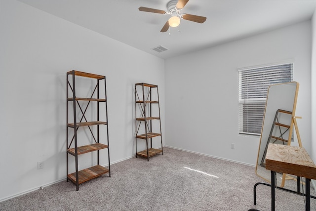 misc room with light carpet and ceiling fan