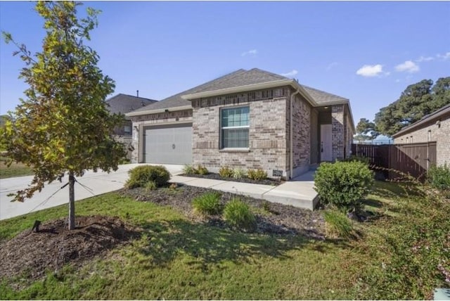 view of front of property with a garage and a front lawn