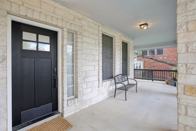 doorway to property featuring a porch