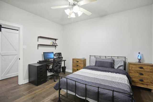 bedroom with ceiling fan and dark hardwood / wood-style floors