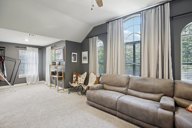 living room with carpet flooring, ceiling fan, and vaulted ceiling