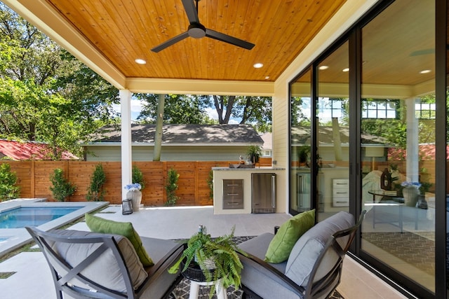 view of patio / terrace featuring ceiling fan, a fenced in pool, and an outdoor hangout area