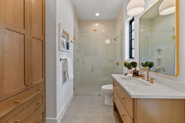 bathroom with tile patterned flooring, toilet, vanity, and a shower with shower door