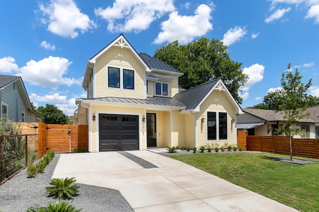 view of front of property with a garage and a front yard