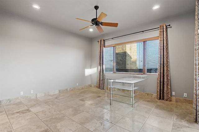 unfurnished room with ceiling fan