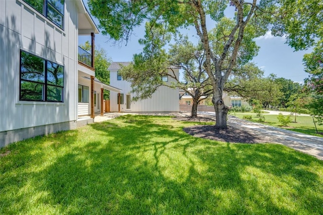 1928 Miles Ave Unit 2, Austin, TX 78745 - view of grassy yard with a balcony