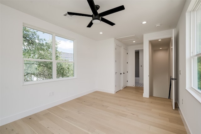 interior space with light hardwood / wood-style floors and ceiling fan