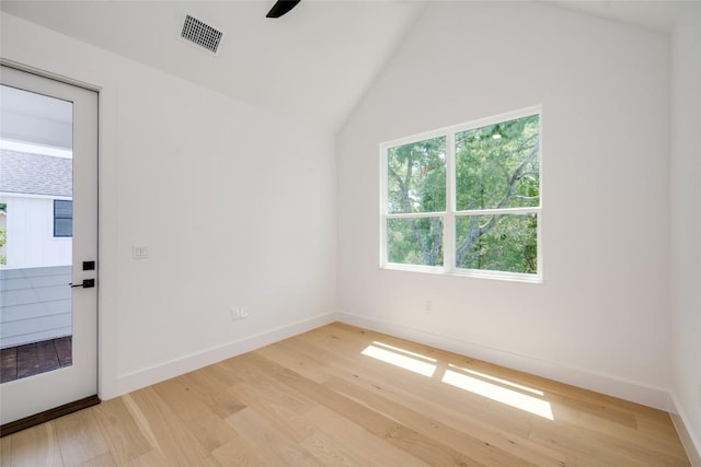 1928 Miles Ave Unit 2, Austin, TX 78745 - unfurnished room featuring light wood-style floors, baseboards, vaulted ceiling, and a ceiling fan