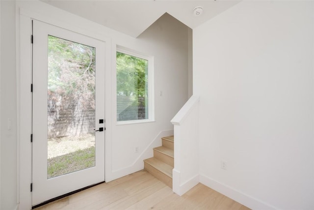 1928 Miles Ave Unit 2, Austin, TX 78745 - entryway featuring light wood finished floors, stairs, and baseboards